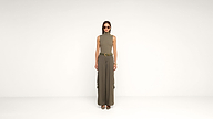 A woman stands against a plain white background, wearing sunglasses, a sleeveless turtleneck top, wide-leg cargo pants, a belt, and heeled shoes. She has straight hair and her hands are by her sides.