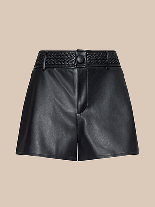The Virelle Short is a pair of black vegan leather, high-rise shorts featuring a braided belt detail and front button closure, showcased against a plain beige background for a sleek, western-inspired look.