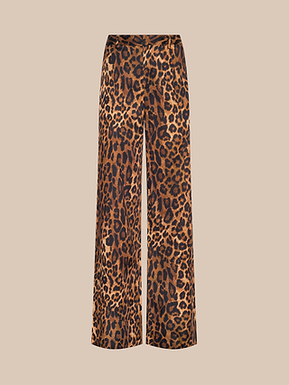 The Livvy Trouser features a wide-leg silhouette with a high waist, crafted from printed twill, and showcases a striking brown, black, and tan leopard print pattern against a light beige background.