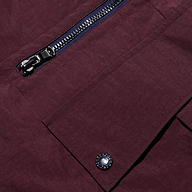 Close-up of water-repellant Monrose Nylon Joggers featuring a zippered pocket and a flap pocket secured with a metallic snap button.