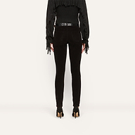 Back view of Marguerite Corduroy Skinny Pant in black, featuring a high-rise waist, a patterned belt, and black stiletto heels.