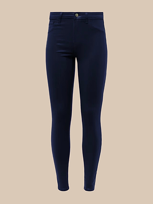 The Marguerite Coated Skinny Jean in dark navy blue features front pockets, a button closure, belt loops, and a tapered leg, crafted from premium stretch denim and displayed against a beige background.