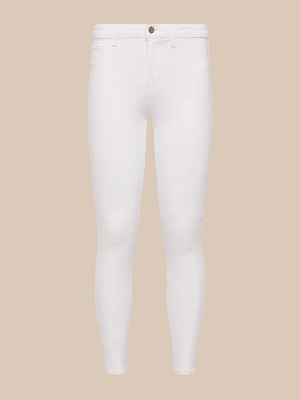 The Marguerite Skinny Jean in white, made from high-recovery fabric with a button and zip closure plus front and back pockets, is shown on a plain beige background.