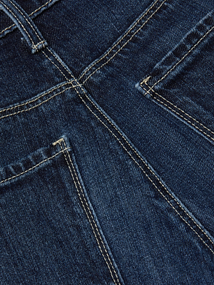 Close-up of L'AGENCE Marguerite Skinny Jean in blue showcasing stretch denim texture, yellow stitching, and details of back pockets and seams.