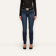 Marguerite Skinny Jean in dark blue with a high-rise fit, styled with a black belt featuring a silver buckle, a black long-sleeve top, and black heels.