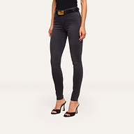 A woman wearing Marguerite Skinny Jean in black, a matching top, a black belt with a gold buckle, and black high-heeled sandals stands against a plain white background.