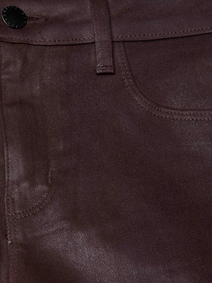 Close-up of the Marguerite Coated Skinny Jean by L'AGENCE in chocolate brown, highlighting the front pocket, waistband, belt loop, black button, and the denim’s slightly shiny finish.