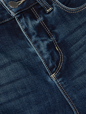Close-up view of the L'AGENCE Marguerite Skinny Jean in dark blue, featuring a high-rise waist, metal button, zipper fly, and visible stitching on super stretch denim.