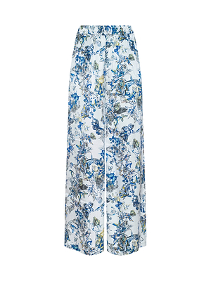 The Lillian Silk Wide-Leg Pant features a blue and green floral print on white, an elasticized waistband, and offers a loose, comfortable fit with a flowy silhouette.