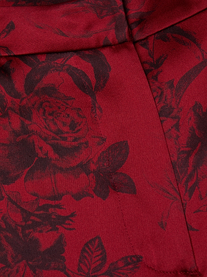 A close-up of the Pilar Silk Wide-Leg Pant by L'AGENCE, crafted in rich burgundy silk.