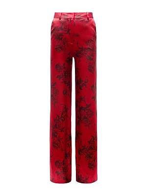 The Pilar Silk Wide-Leg Pant by L'AGENCE features a high-waisted, tailored fit in burgundy silk with a bold black floral print and belt loops, blending elegance and statement style.