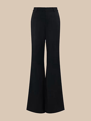 The Pilar Wide-Leg Pant features a high-rise, wide-leg silhouette in black suiting fabric with a tailored fit, belt loops, front seam, and four-way stretch, shown against a plain beige background.