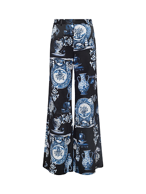The Pilar Silk Wide-Leg Pant by L'AGENCE features a high-rise fit and showcases a blue and white porcelain floral print on smooth, glossy silk for an elegant, refined look.