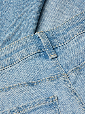 Close-up of the Ruth Straight-Leg Jean in vintage wash, highlighting the waistband, belt loop, and upper back pocket with detailed stitching and rich denim texture.