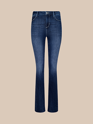 Ruth Straight-Leg Jean in rich indigo wash, featuring front and back pockets, visible stitching, a button closure, and crafted from high-rise denim, displayed on a plain beige background.