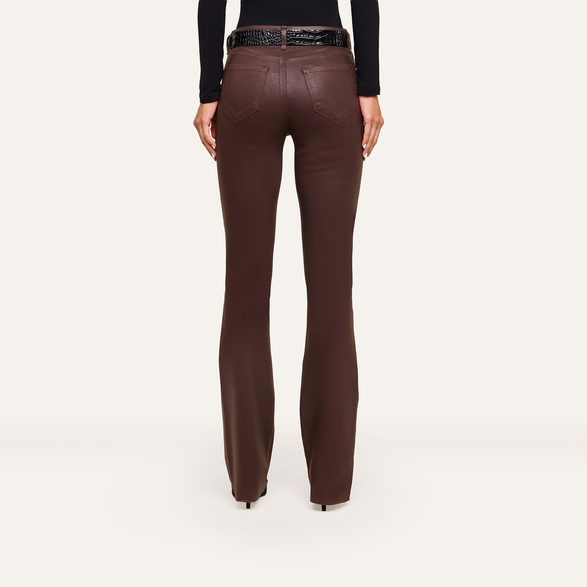 Rear view of Ruth Coated Straight-Leg Jean in dark brown, high-rise straight-leg coated stretch denim, styled with a black textured belt.