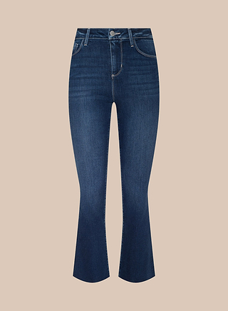The Kendra Cropped Flare Jean features a dark blue wash, high-rise fit, and cropped flare silhouette. Designed with front and back pockets, belt loops, and a button closure, these jeans are crafted from super stretch denim and are displayed on a plain beige background.