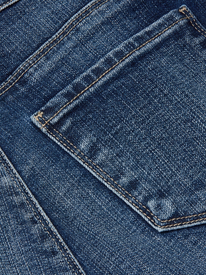 Close-up of the Kendra Cropped Flare Jean by L'AGENCE, featuring blue stretch denim with a back pocket, visible stitching, and faded areas that highlight the jeans’ textured details.