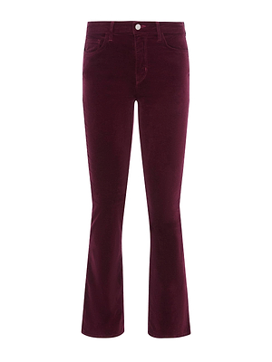 The Stevie Velvet Jean by L'AGENCE features flare legs, front and back pockets, a button closure, and a zip fly, shown in maroon on a white background.