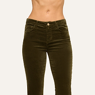A person wearing the Stevie Velvet Jean in a high-rise, dark green stretch velvet fabric with a straight leg fit, shown from mid-torso to thighs against a plain light background.
