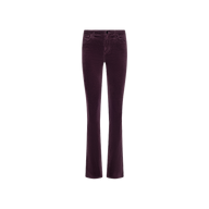 The Stevie Velvet Jean is a pair of plum-colored stretch velvet jeans featuring a fitted waist, button and zip closure, and slightly flared legs, displayed on a white background.