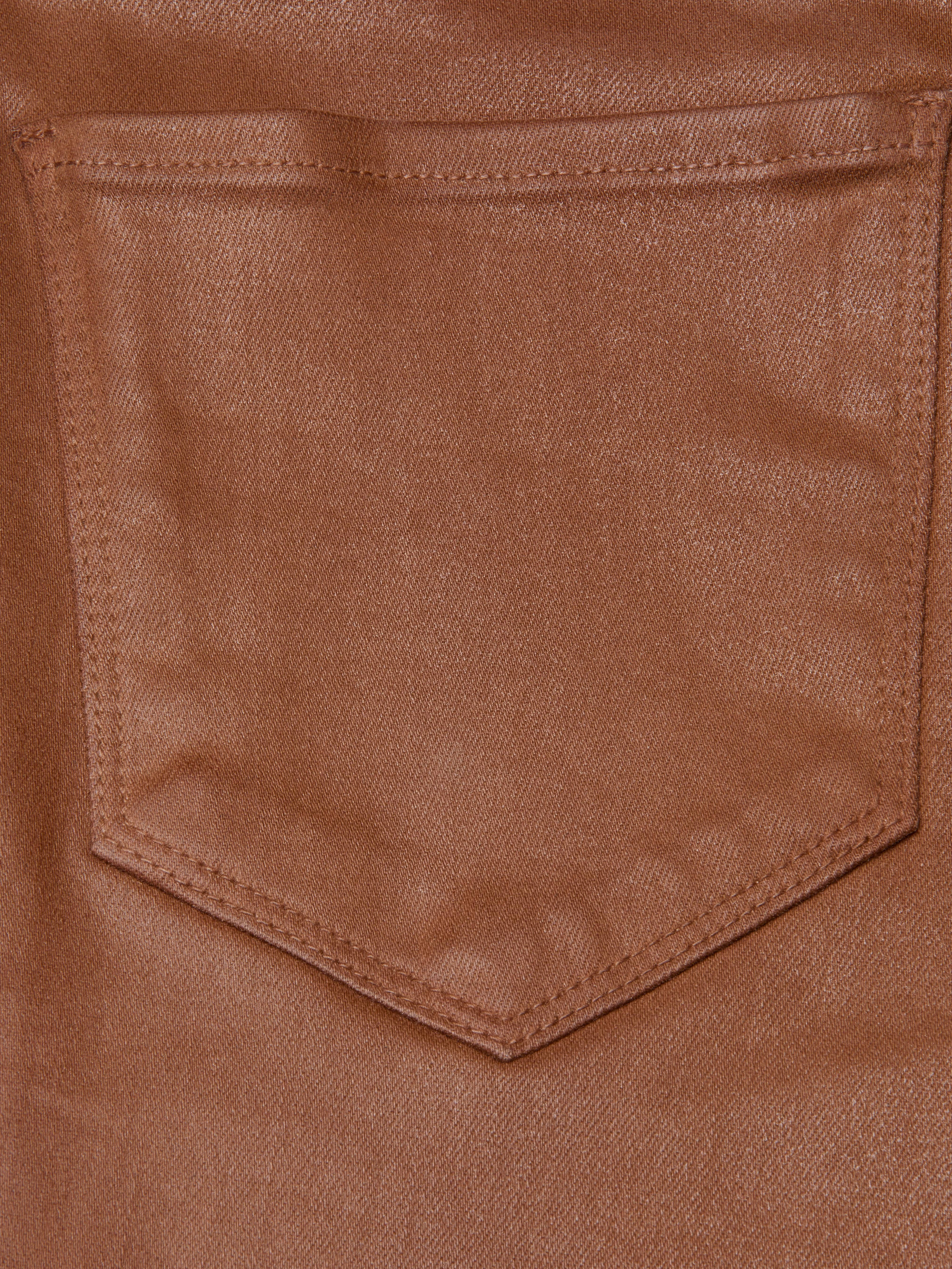 Close-up of a brown Selma Coated Bootcut Jean pocket, crafted from leather-alternative denim with visible detailed stitching and texture. The empty pocket is centered in the image.