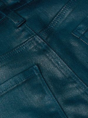 Close-up of the Selma Coated Bootcut Jean by L'AGENCE in dark blue, showcasing the fabric's texture, detailed stitching, and features of the pockets and waistband.