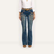 Selma Embellished Bootcut Jean in blue, featuring floral embroidery and crystal details on the hips and thighs, worn with a tan belt and ankle boots.