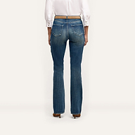 Rear view of blue Selma Embellished Bootcut Jean with crystal-embellished pockets, worn with a white button-down shirt and a thin tan belt.
