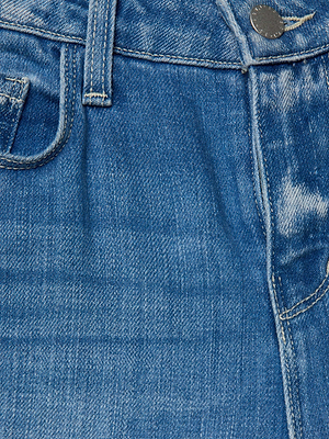 Close-up of the Selma Bootcut Jean by L'AGENCE Sale in blue stretch denim, highlighting the waistband, metal button, belt loop, front pocket, and visible stitching details.