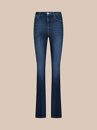 The Marty Flare Jean, featuring a dark blue wash, high-rise fit, subtle flare leg, front button and zipper closure, and classic five-pocket styling, is displayed against a plain beige background.