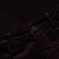 Close-up of the Marty Velvet Pant in a dark purple or black shade, highlighting the high rise waistband, belt loops, button closure, and detailed stitching.
