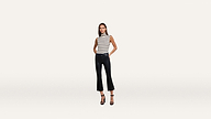 A woman stands against a plain white background wearing a sleeveless black-and-white striped top, black cropped pants, and stylish black high-heeled sandals.