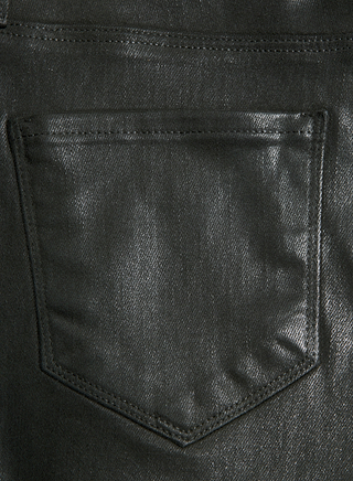 Close-up of the Kendra Coated Cropped Flare Jean in black, highlighting the denims coated finish and a single back pocket with visible stitching.