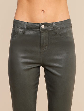 A person wearing the Kendra Coated Cropped Flare Jean in metallic ash olive green. The photo shows the jeans from the waist to mid-thigh against a neutral background.
