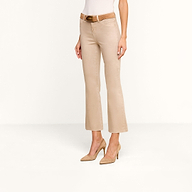 Woman wearing Kendra Coated Cropped Flare Jean in a high rise beige style, paired with a brown belt and beige high heels, standing against a plain white background. Upper body is partially out of frame.