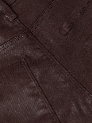 Close-up of the Kendra Coated Cropped Flare Jean in dark brown, highlighting its coated denim fabric, visible stitching, seams, and pocket edges.