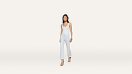 A woman in a white sleeveless top and light blue flared pants walks forward, wearing sandals and a delicate necklace, set against a plain white background.