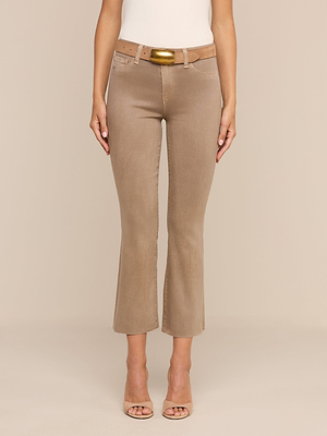 A person wearing the Kendra Coated Cropped Flare Jean with a matching beige belt and nude heels stands against a plain beige background, showcasing only the lower half of their body.