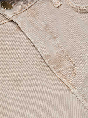 Close-up of the Kendra Cropped Flare Jean in neutral tan super stretch denim, highlighting the waistband, metal button, pocket seam, and detailed stitching. The fabric’s texture and craftsmanship are clearly shown.