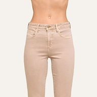 Wearing the Kendra Cropped Flare Jean in a high-waisted, neutral tan super stretch denim, this person stands against a plain light background showing only the torso and upper legs.