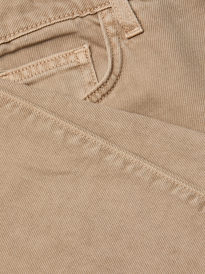 Close-up of the Wanda Cropped Wide-Leg Jean in beige all-cotton denim, featuring visible stitching, a pocket, and a seam to highlight the fabric’s texture and weave pattern.