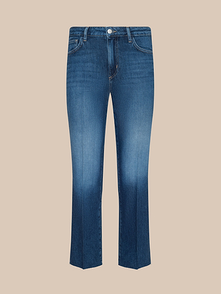 Wanda Cropped Wide-Leg Jean in blue featherweight denim, featuring a button and zipper closure, front and back pockets, and light fading on the thighs. Displayed against a plain beige background.