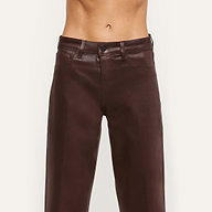 A person wearing the Wanda Coated Cropped Wide-Leg Jean in a high-waisted, dark java brown style; photo shows torso and legs with no shirt visible, set against a plain light background.