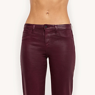 A person wearing the Wanda Coated Cropped Wide-Leg Jean in burgundy is shown from mid-torso to knees against a plain white background.