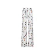 The Kimia Satin Pant is a white, high-rise, wide-leg pajama pant crafted from satin and adorned with a colorful, playful print of cartoon animals and whimsical objects scattered across the fabric.