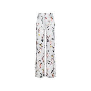 Kimia Satin Pant in white satin, featuring wide-leg design and a whimsical multicolored cartoon and butterfly lock print with playful characters and scattered objects, shown against a plain white background.