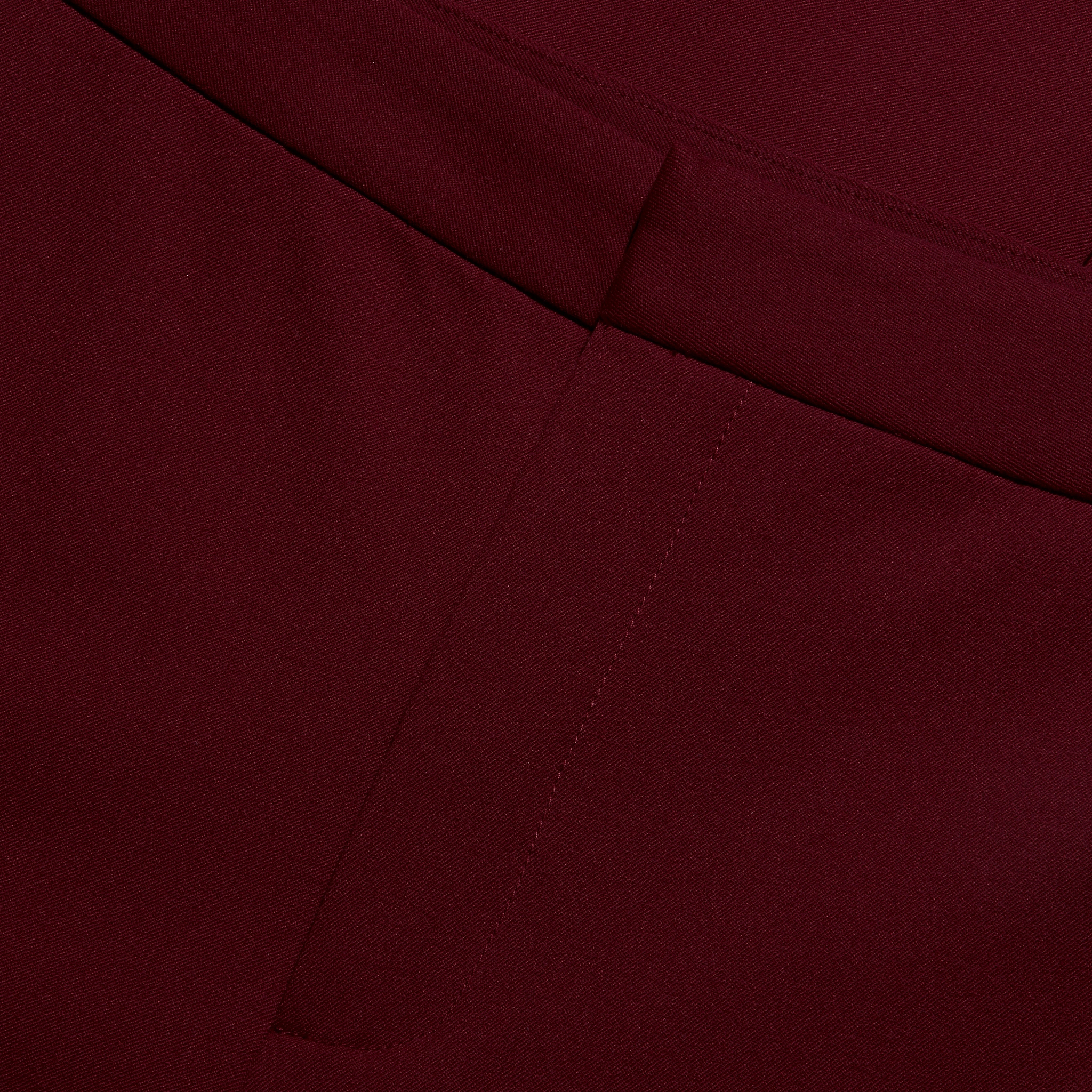 Close-up of the waistband and fly of the deep red stretch twill Rebel Trouser in a slim-straight fit.