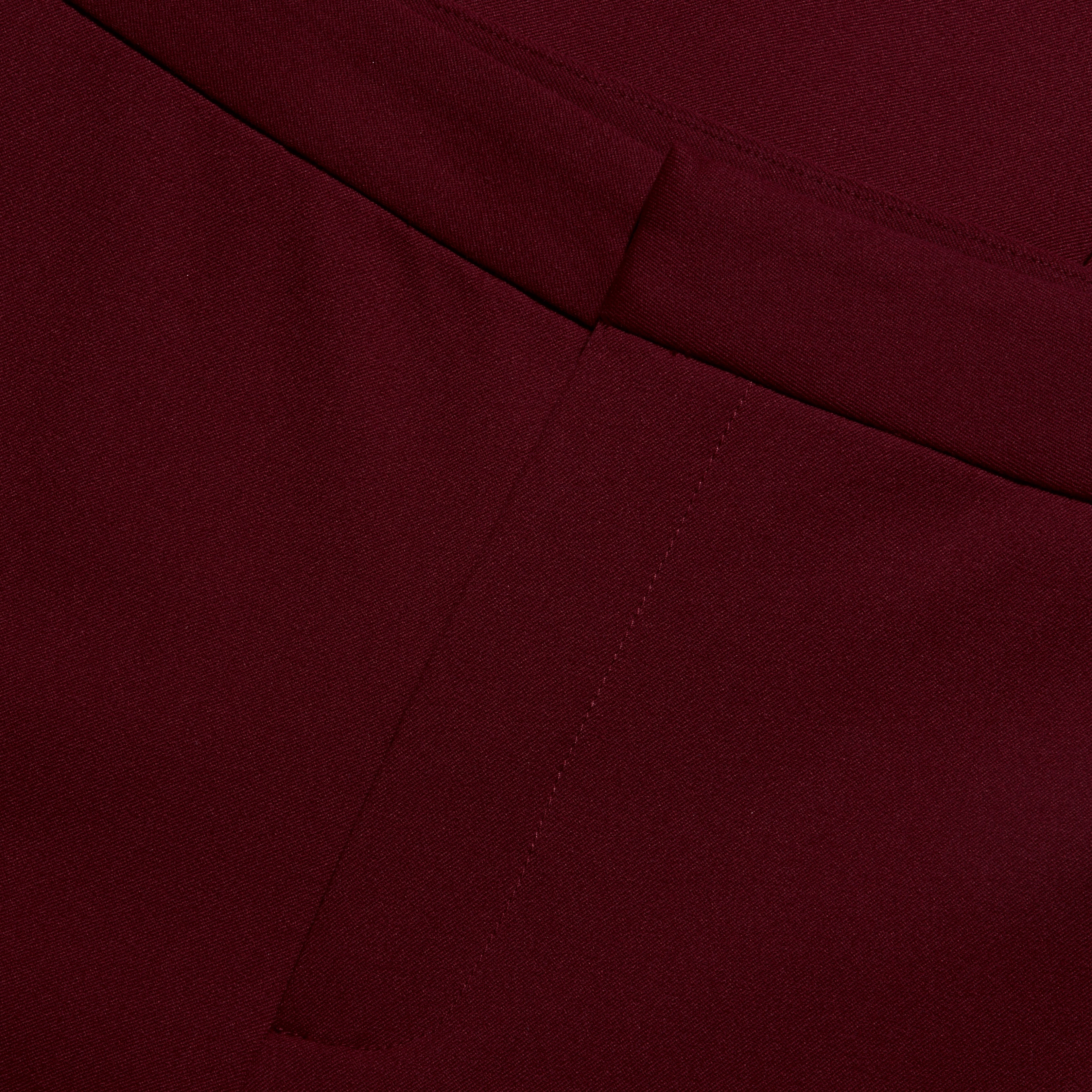 Close-up of the waistband and fly of the deep red stretch twill Rebel Trouser in a slim-straight fit.