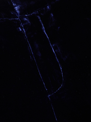 Close-up of midnight blue velvet with visible stitching and sheen, highlighting the soft texture of L'AGENCE Rebel Velvet Trouser—ideal for high-rise straight-leg style.